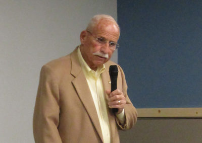 Ray Hunkins addresses the audience during a program at the Platte County Library